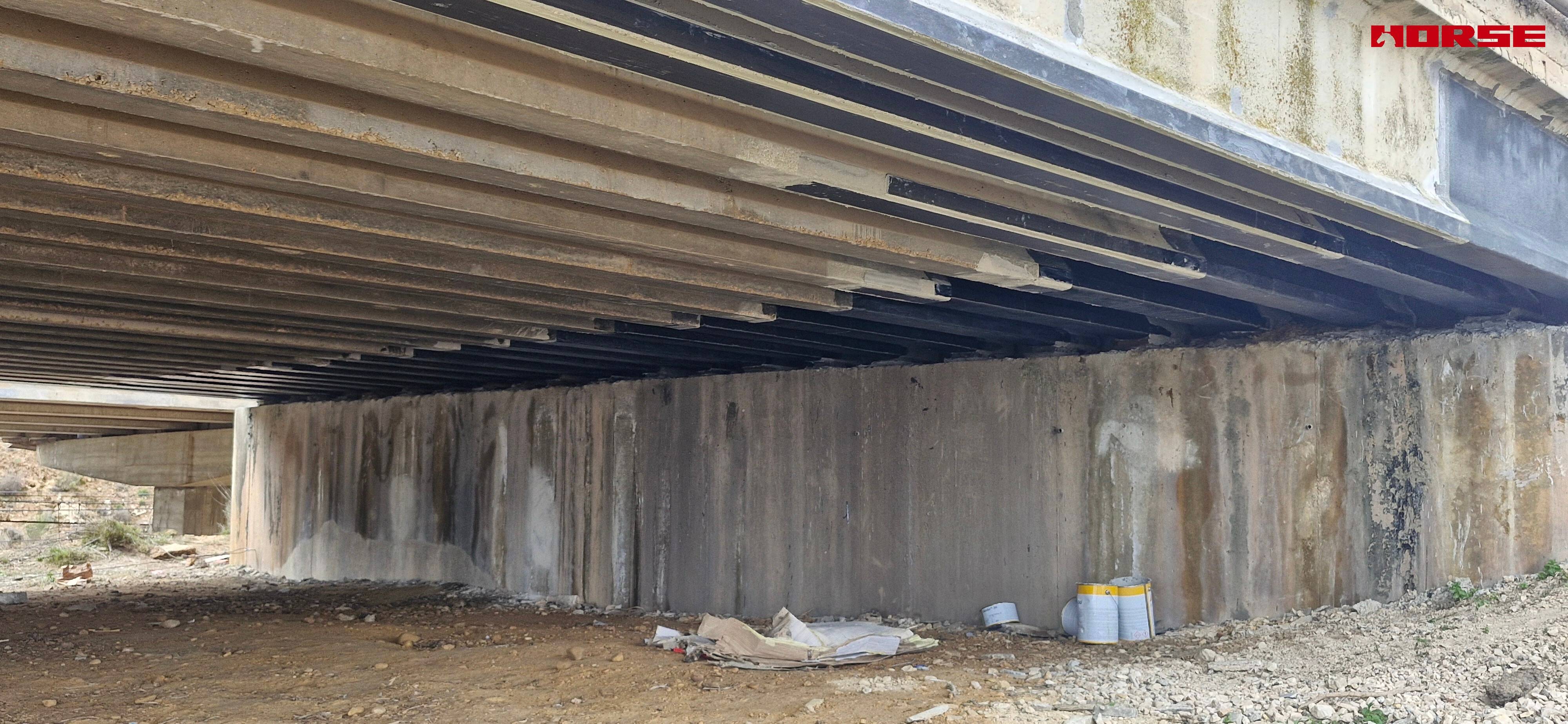 Strengthening of a Prestressed Concrete Multi-Girder Bridge with CFRP Laminate and U-warp Strengthening of a Prestressed Concrete Multi-Girder Bridge with CFRP Laminate and U-warp